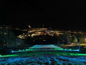 Exterior Ski Slop cross-lighting to advertise Illuminate