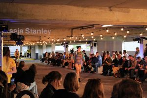 Model walking down car park catwalk