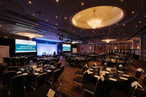 A large conference room all set up for the National Neurology Transformation meeting.